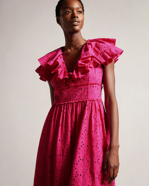 MIRZA-Dresses-Every day is a fashion show in MIRZA. Featuring a delicate broderie design and playful ruffles, this midi dress was made for strutting your stuff through the bustling city streets. Whether you're sipping lattes at a chic café, indulging in retail therapy, or embarking on a romantic rendezvous, this dress guarantees an unforgettable entrance.The fabric of this product is made of 100% organic cotton. Organic cotton has a proven lower environmental impact than conventional cotton, as it reduces